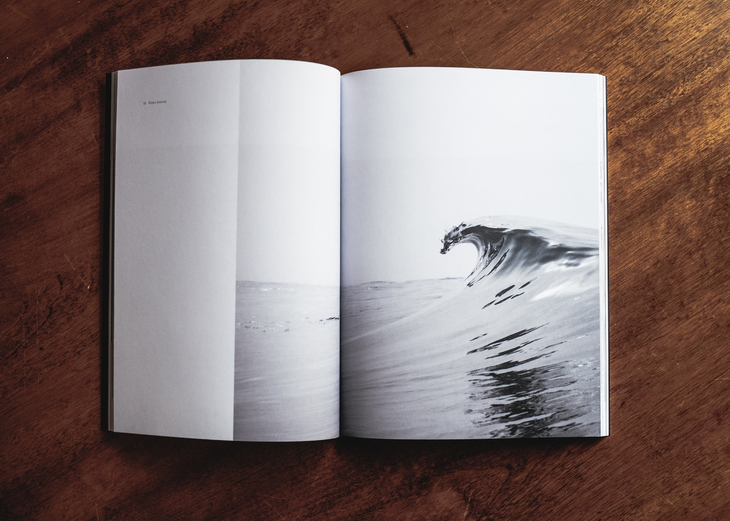 Photography book on wooden table.