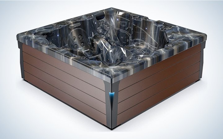  A Luxuria hot tub on a blue and white background