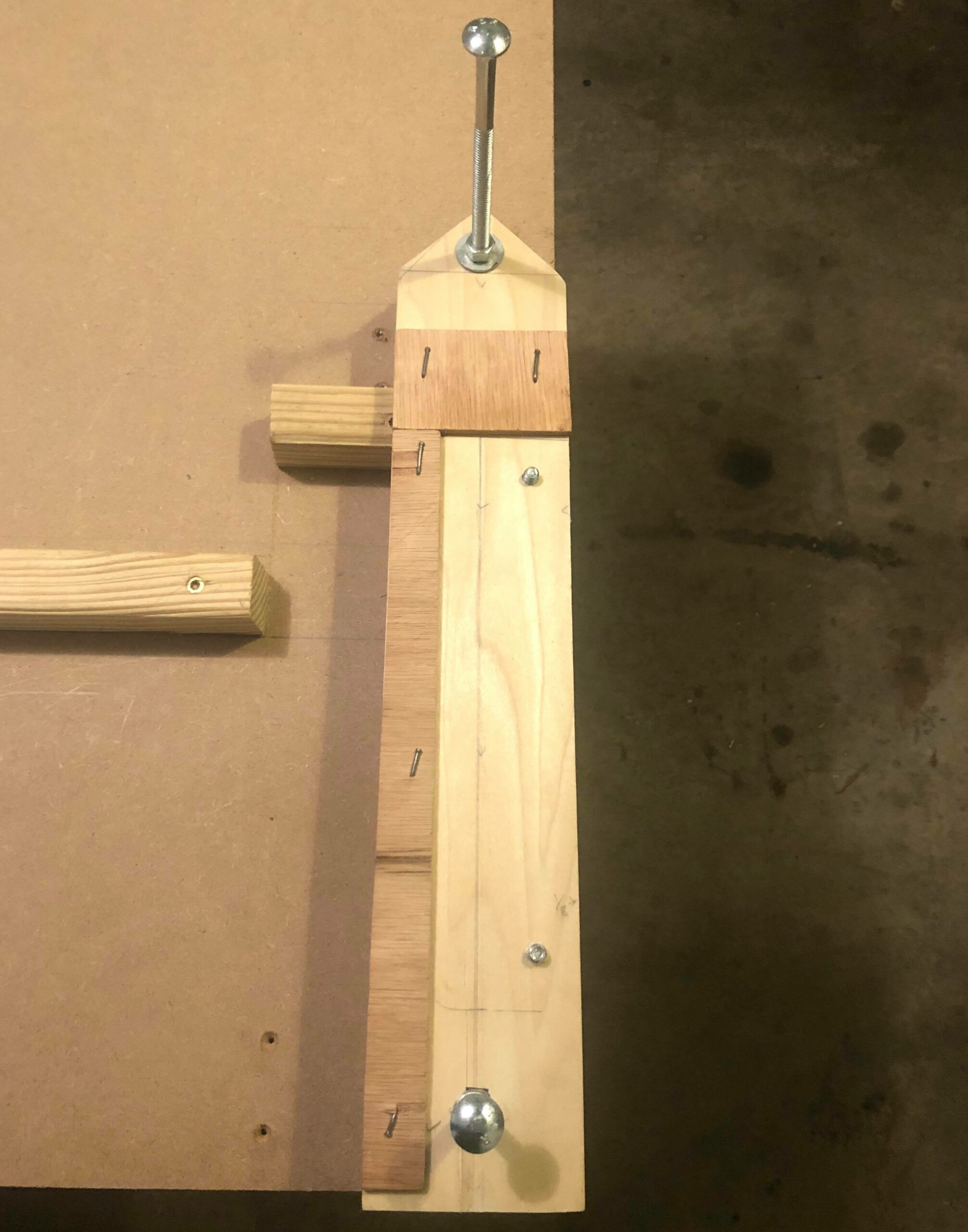 a chop saw jig saw platform, with bolts and a Lauan plywood fence