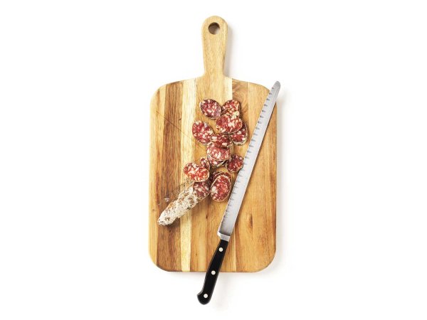 Salami cut on cutting board with knife.