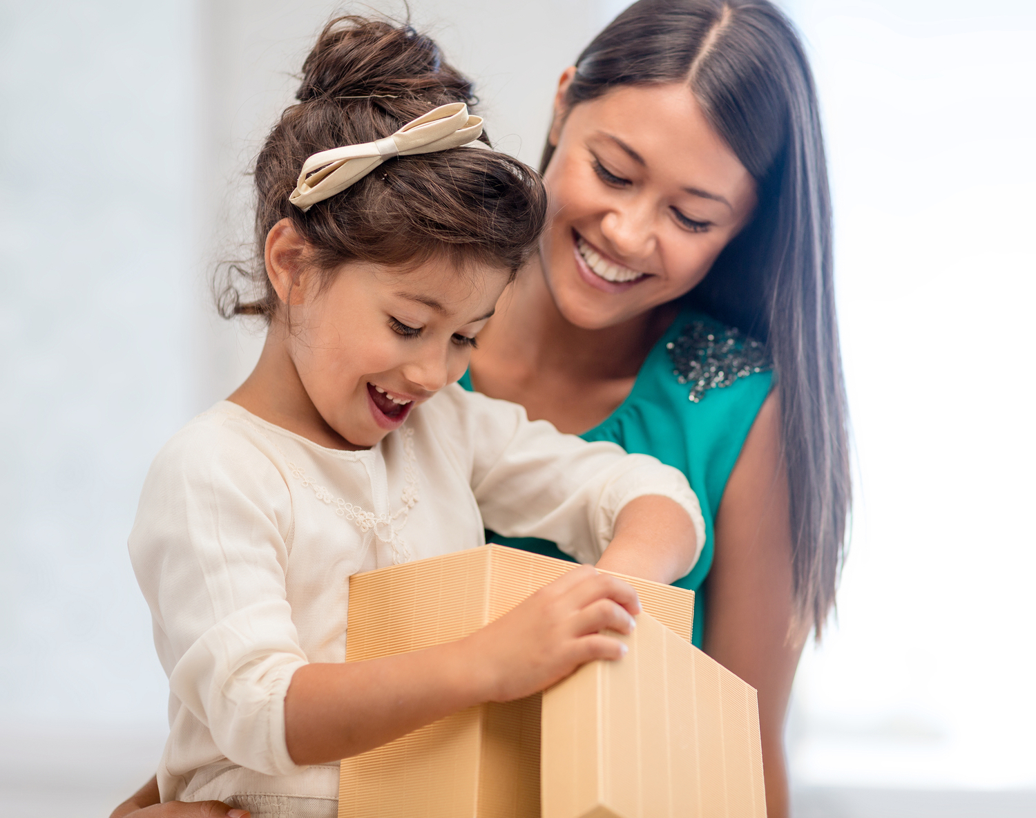 mother and girl with gift box