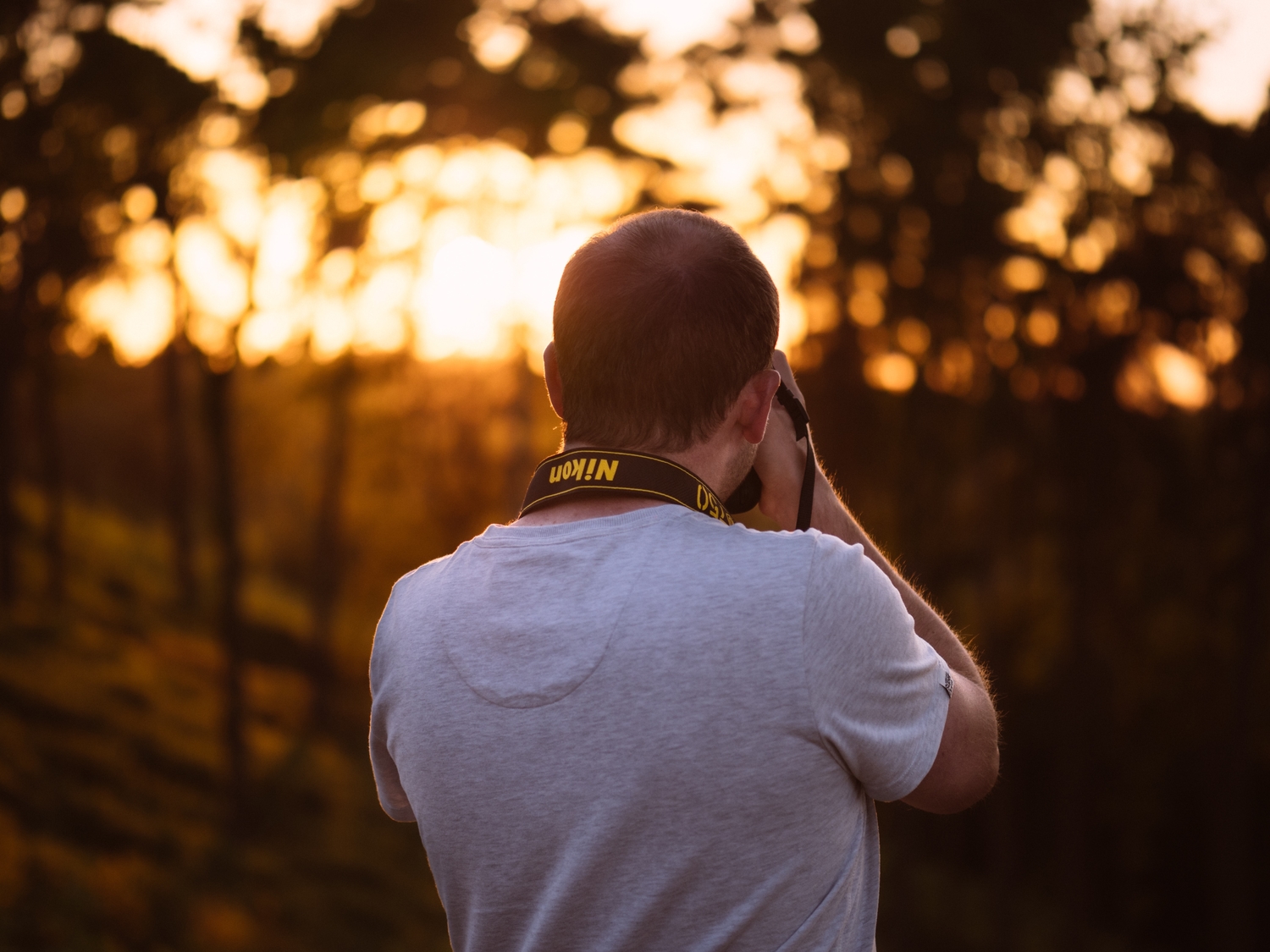 Person shooting photo at sunset.