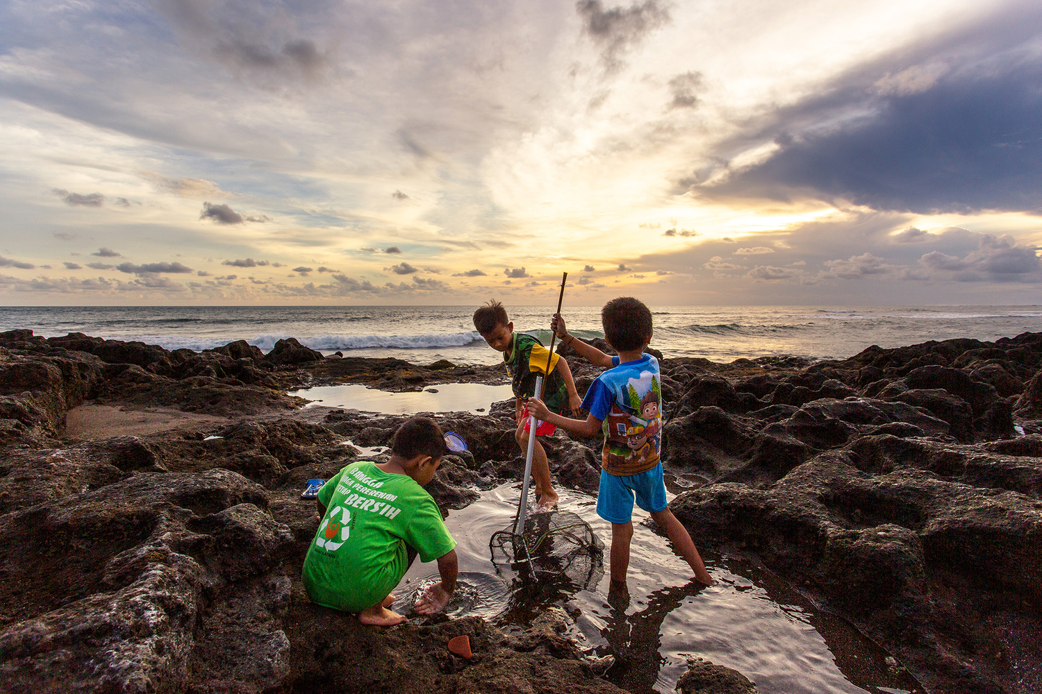 Kids fishing at sea shore