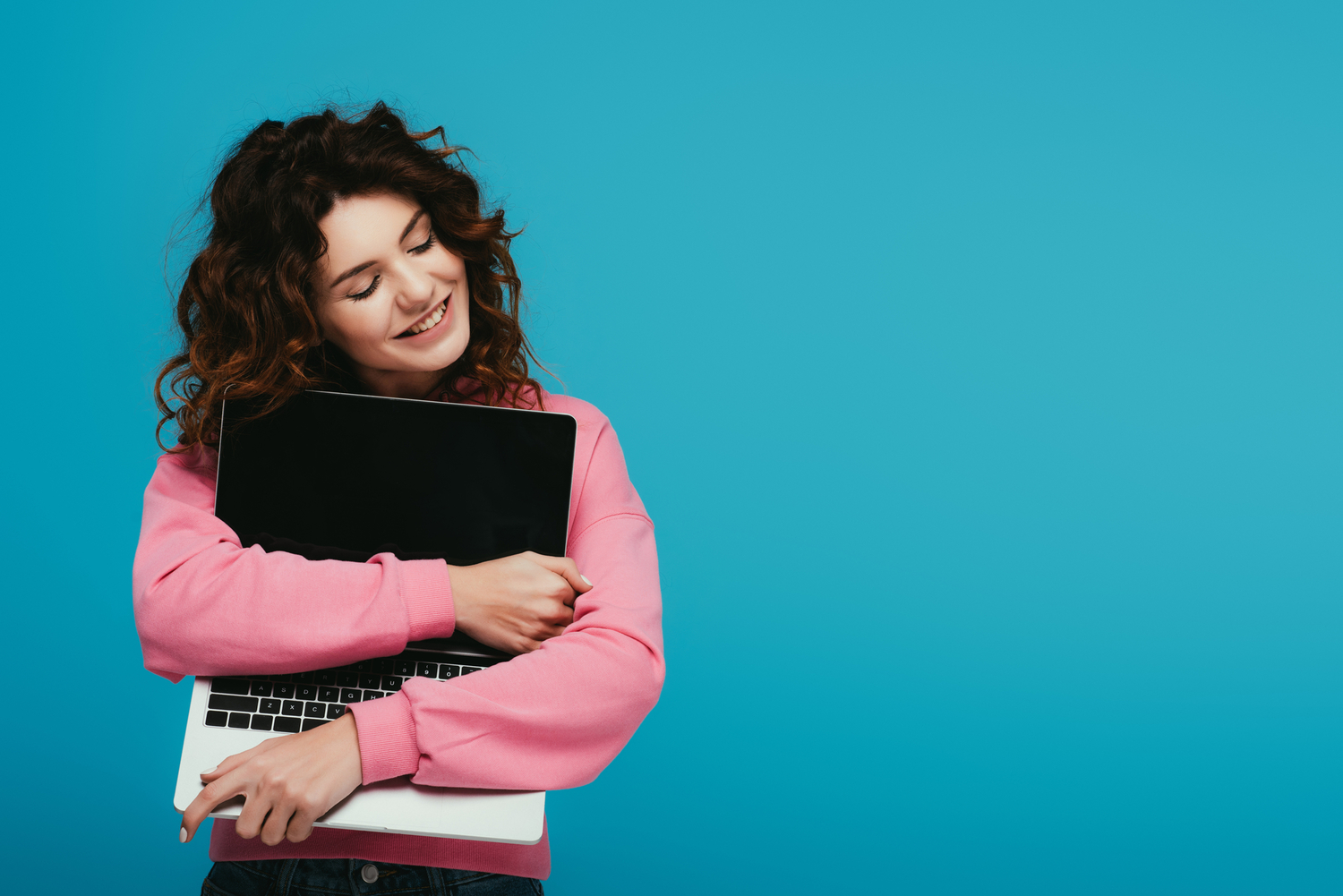 Person hugging computer