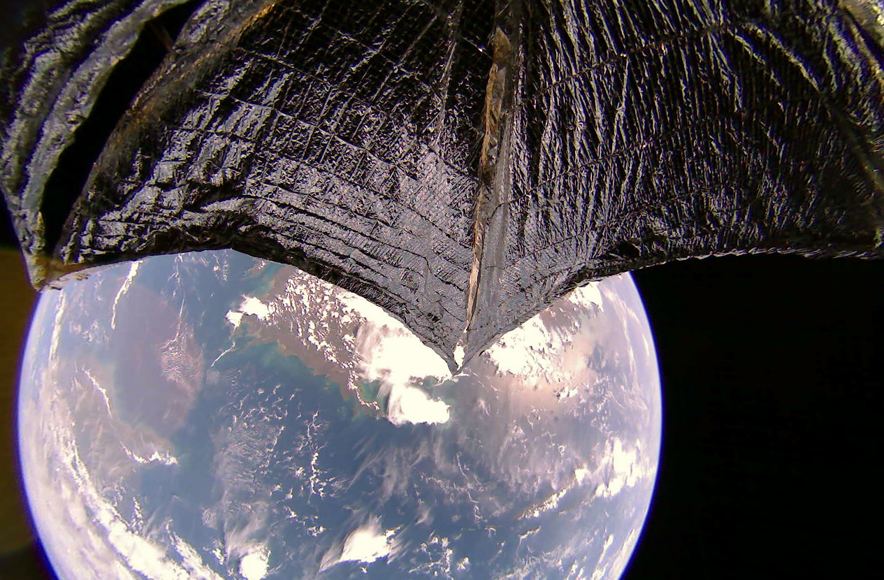 lightsail 2's wing in the foreground, Earth and Australia in the background