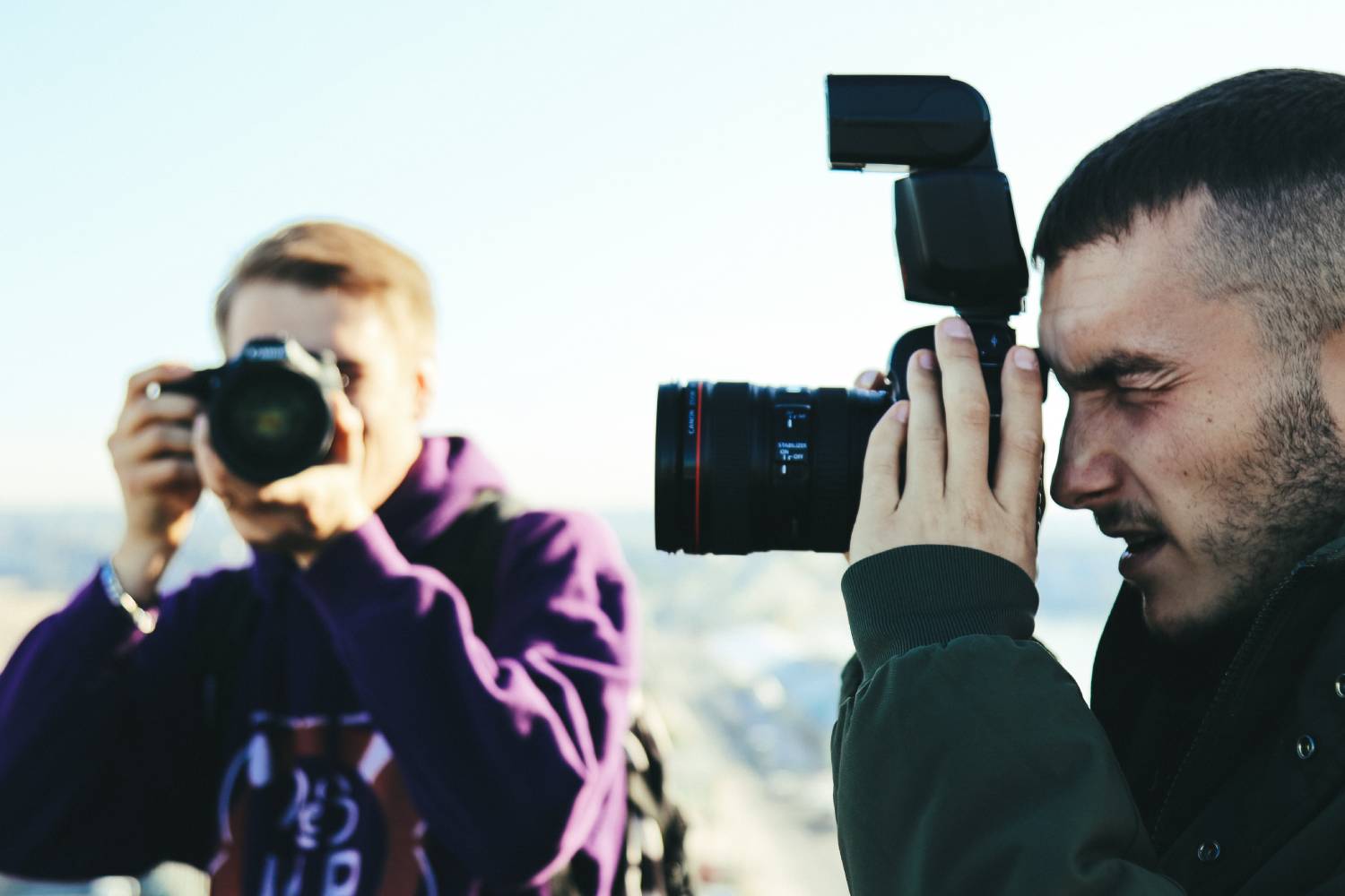 Two people taking photographs