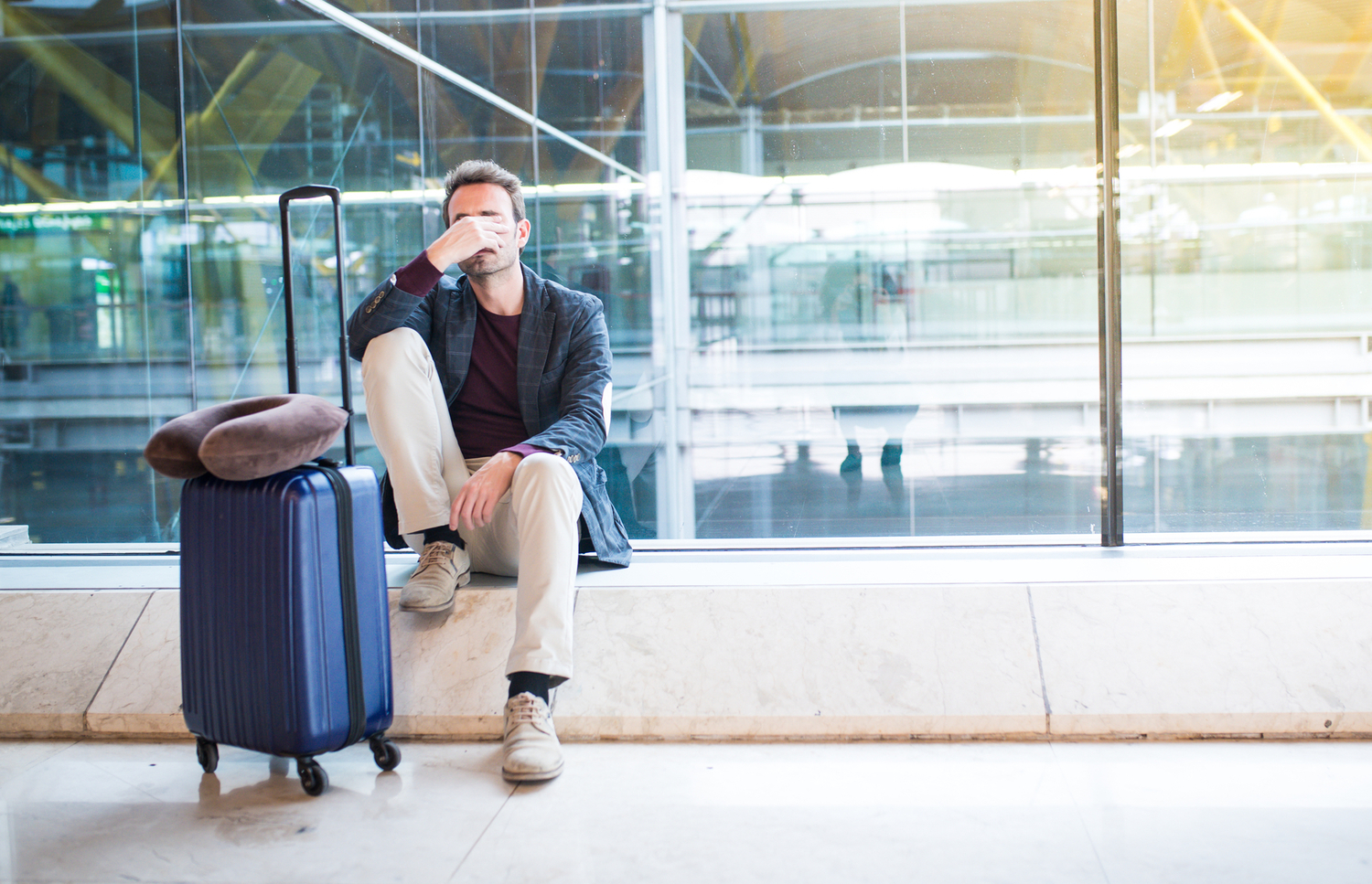 Person upset at the airport his flight is delayed