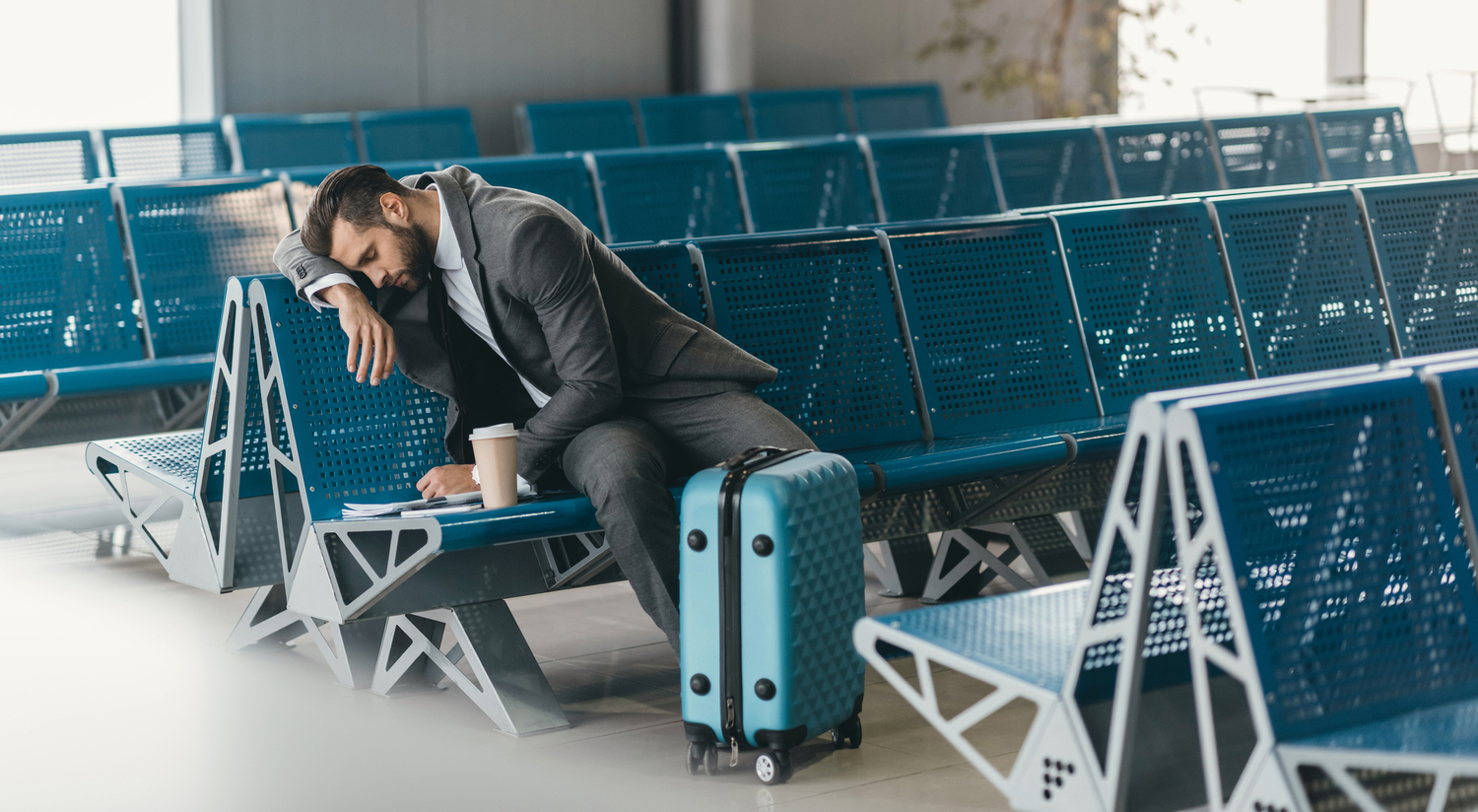 Person sleeping in boarding room at airport