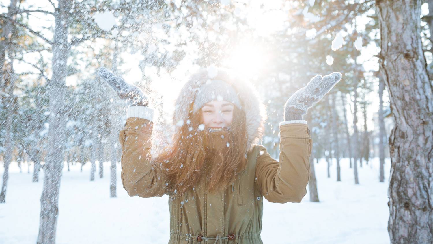 Person playing with snow