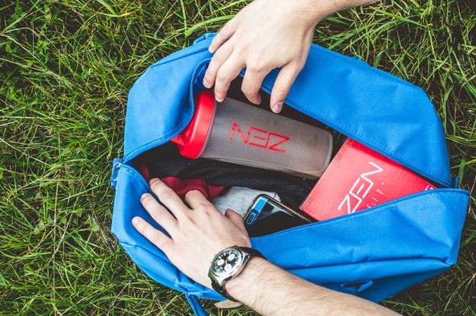 gym bag with person reaching into it