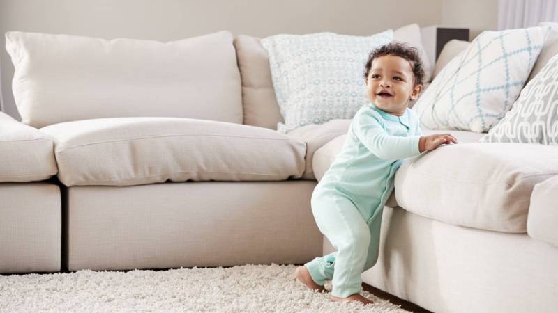 baby walking in living room