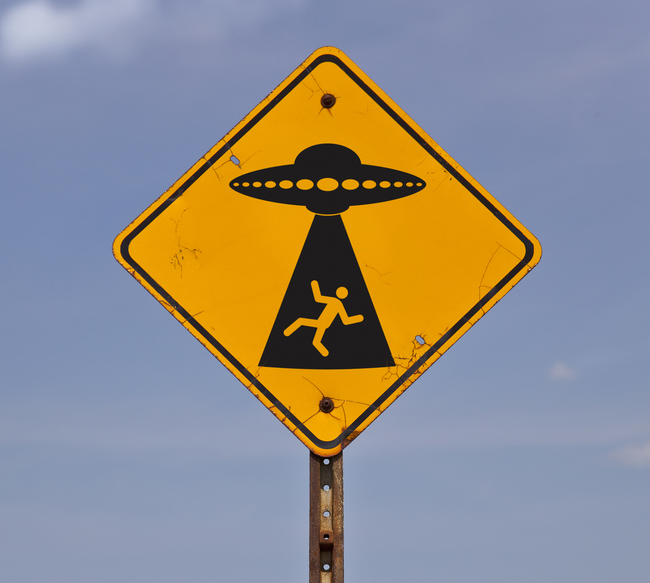 A road sign warning of possible alien abduction