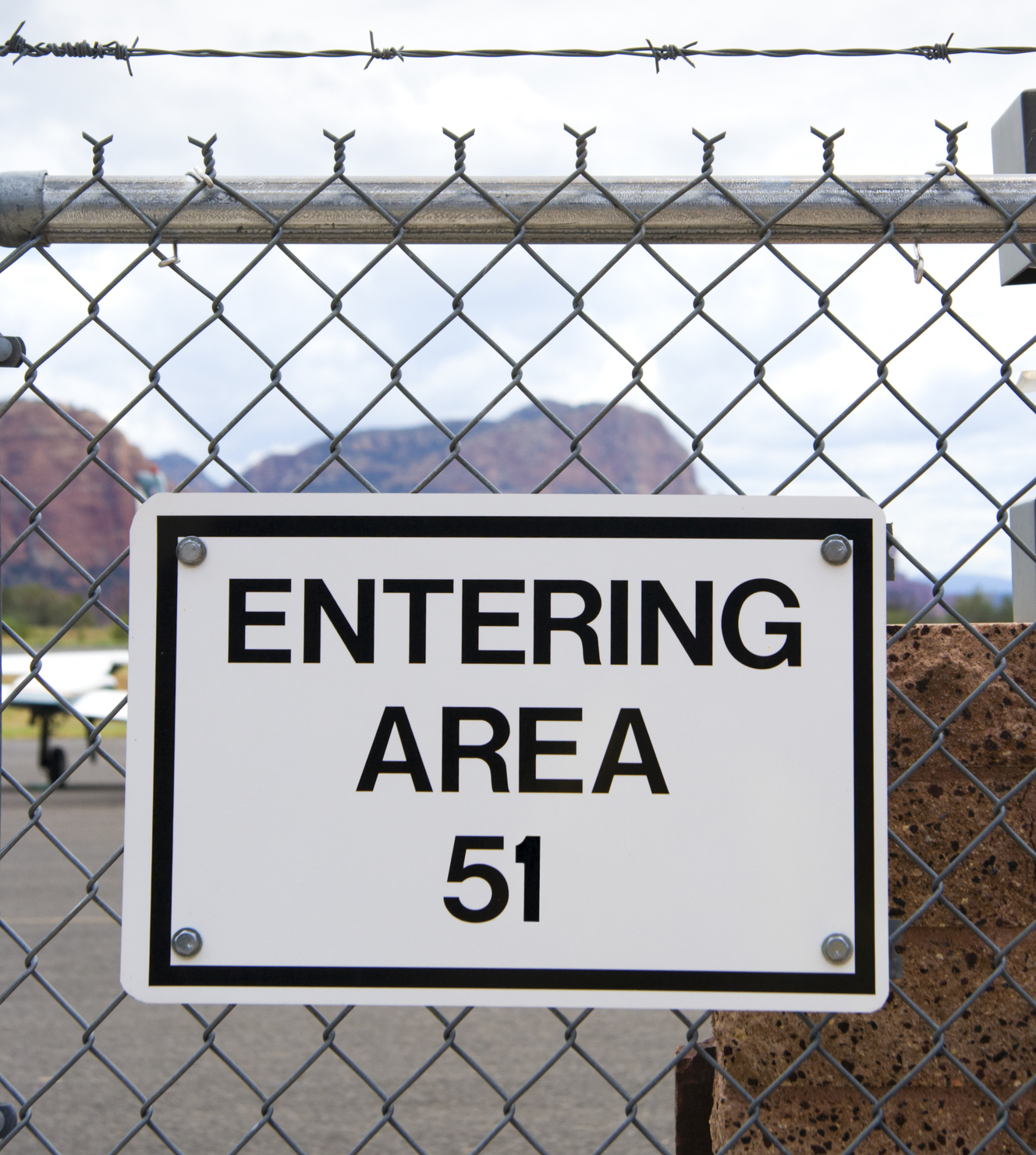 A fence sign for Area 51