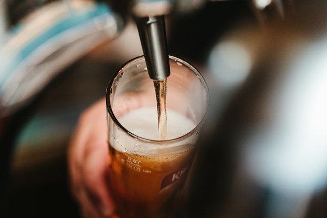 pouring a beverage from tap