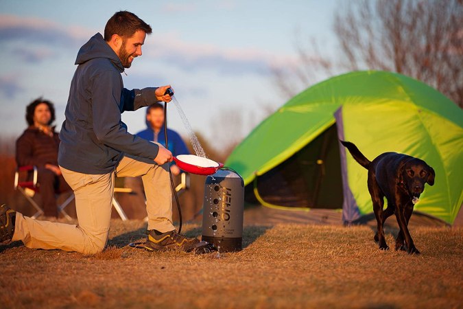 people and dog with outdoor shower