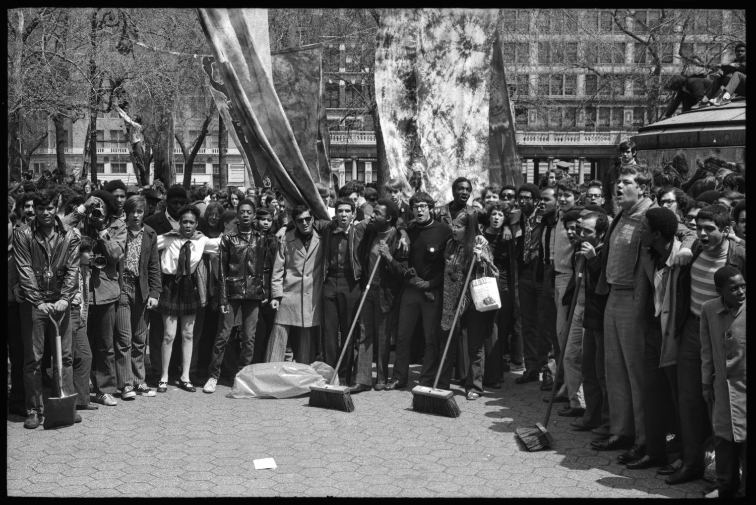 a photo of people in Union Square Park in New York City during the first Earth Day in 1970