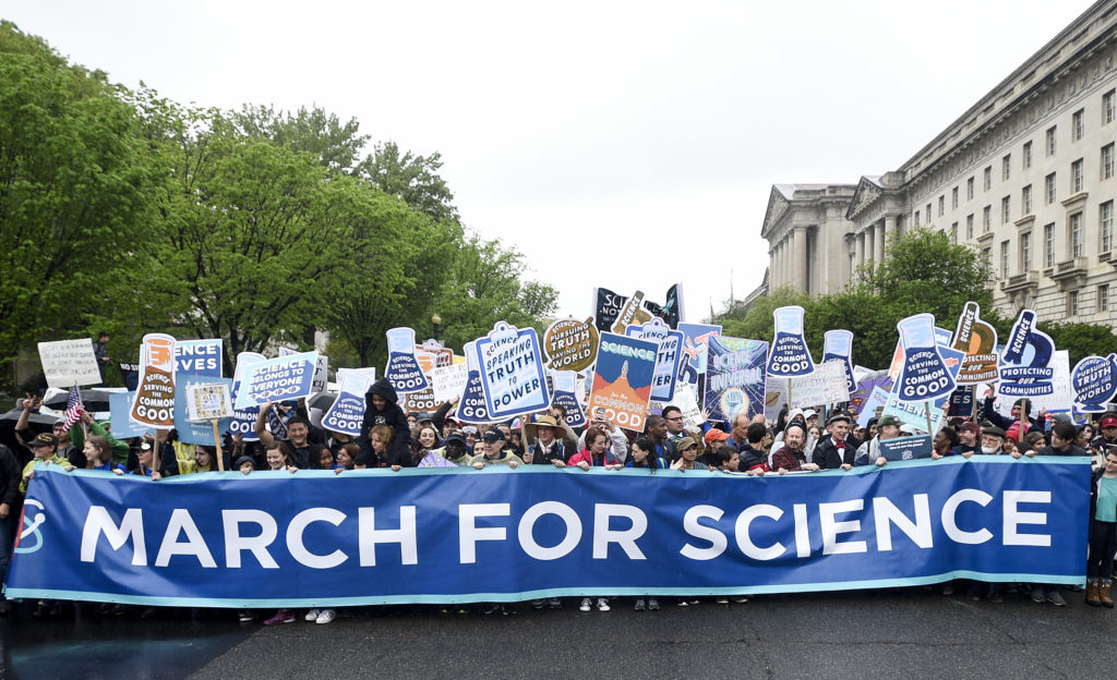 a group of people participating in the 2017 March for Science in Washington, D.C.