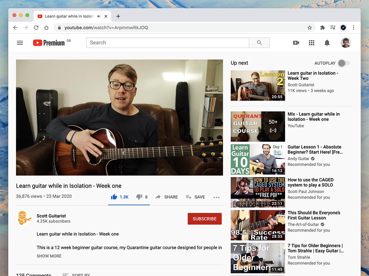 a person teaching guitar on YouTube