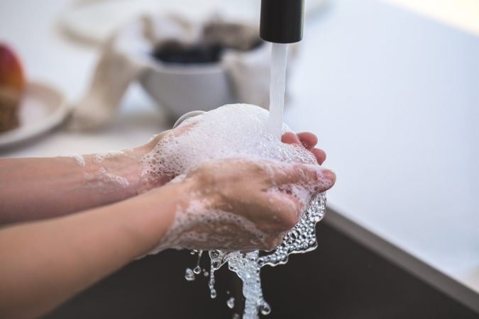 person washing their hands