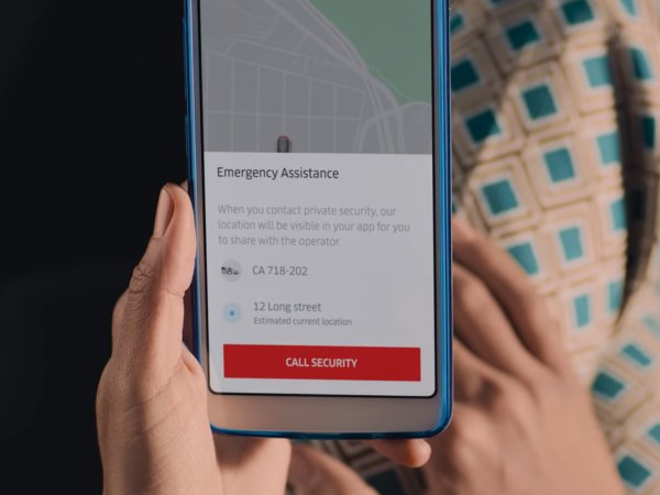 a person holding a phone with the Uber app's "call security" button displayed