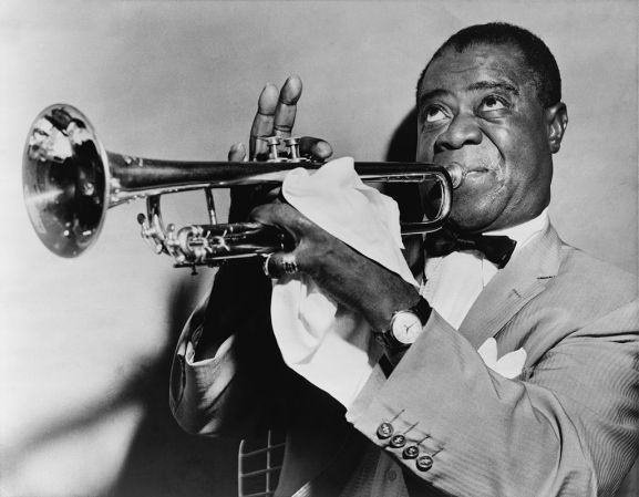 Louis Armstrong playing a trumpet