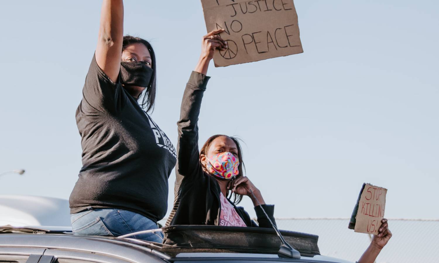 People protesting from a car