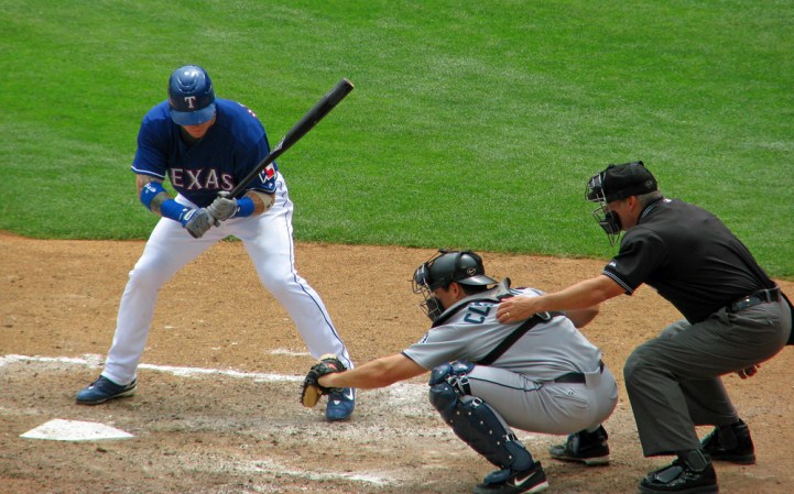 An MLB umpire calls a strike or a ball during a 2019 game.