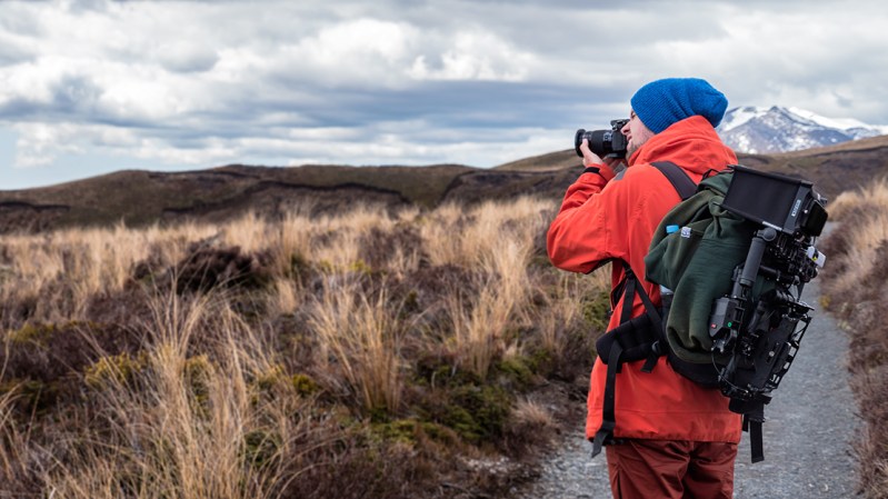 person with camera on a mountain