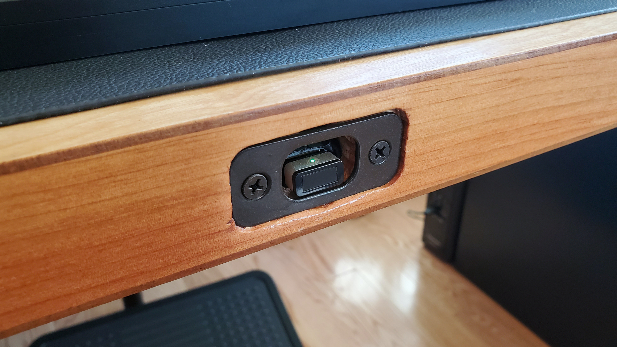 A built-in fingerprint scanner in a homemade DIY computer desk.