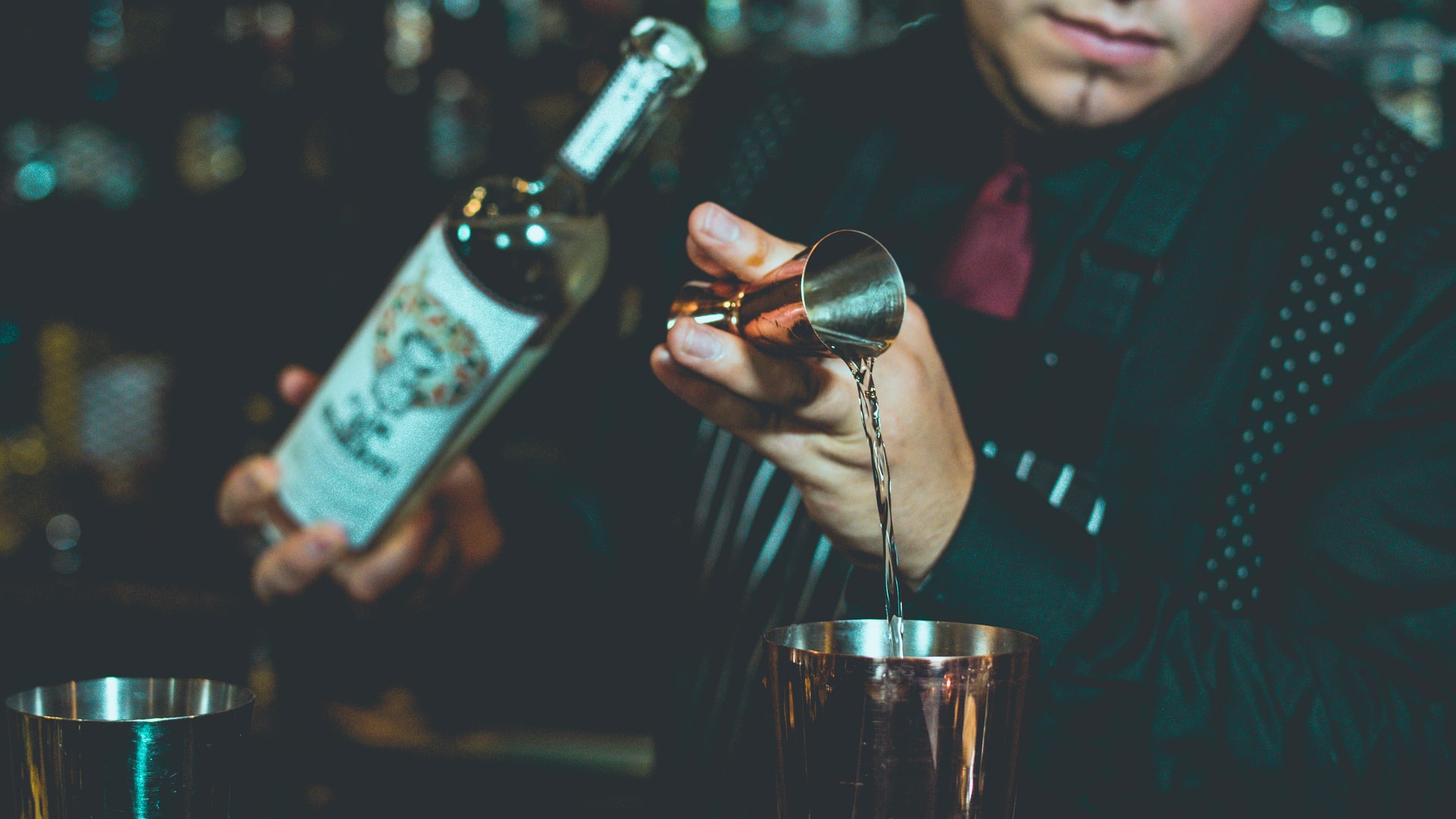 A bartender in Mexico pouring a tequila shot