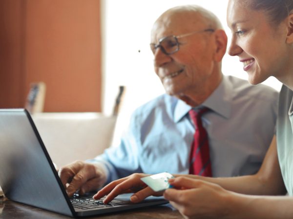 older man working on his computer