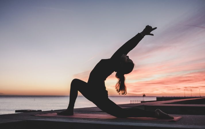 person stretching doing yoga