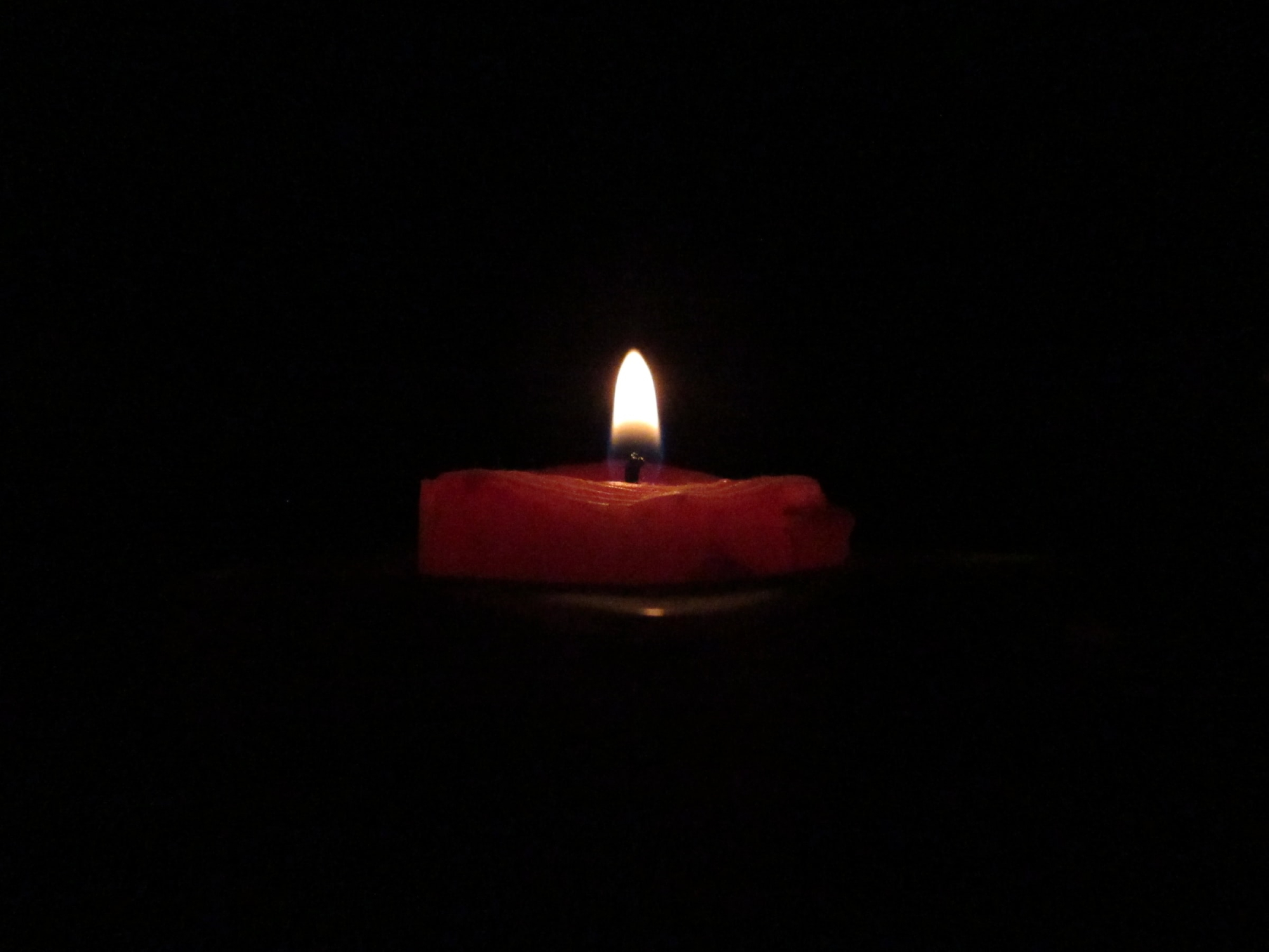 a candle in the darkness