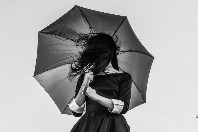 a woman holding an umbrella