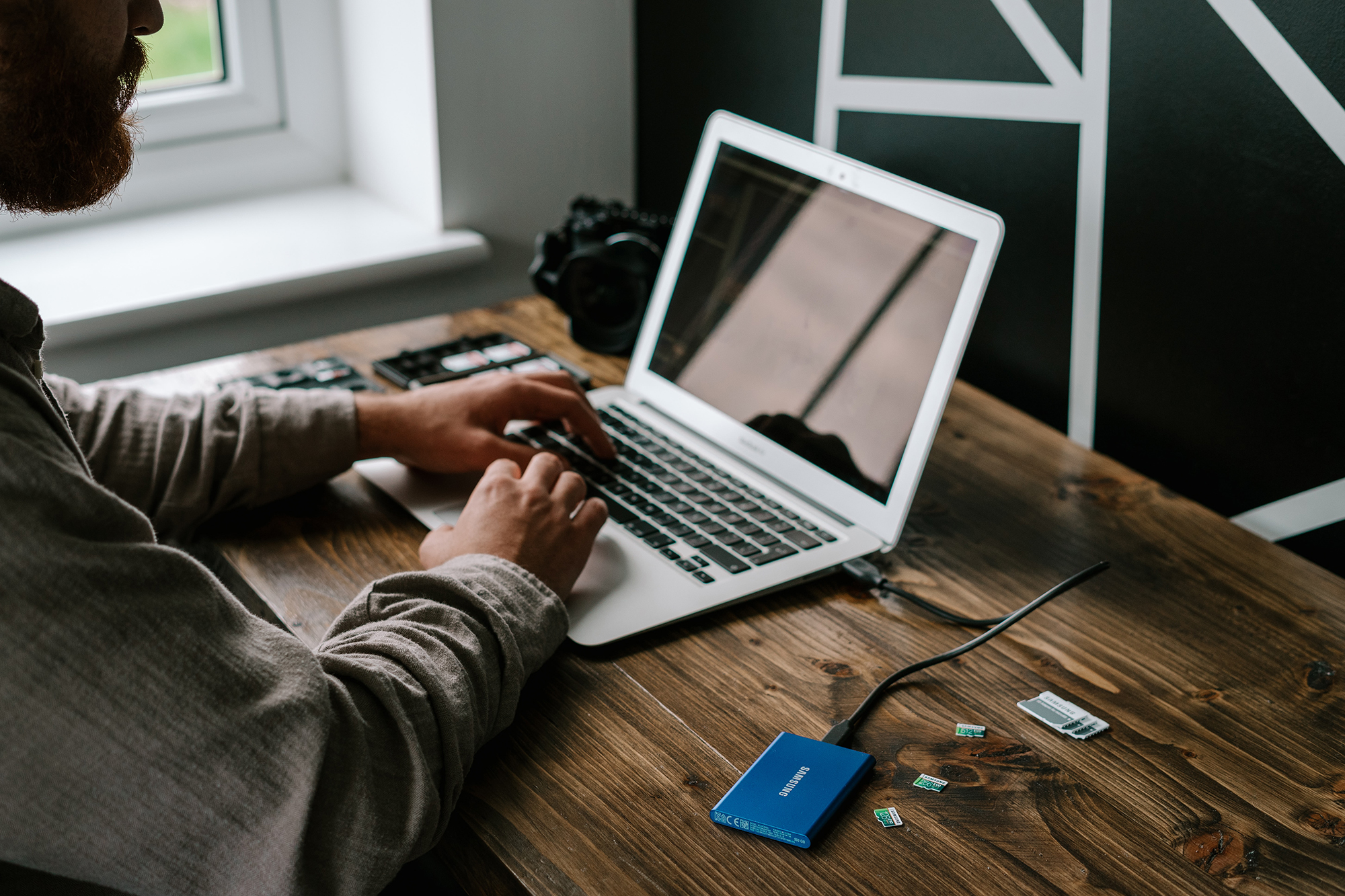 person typing at a laptop