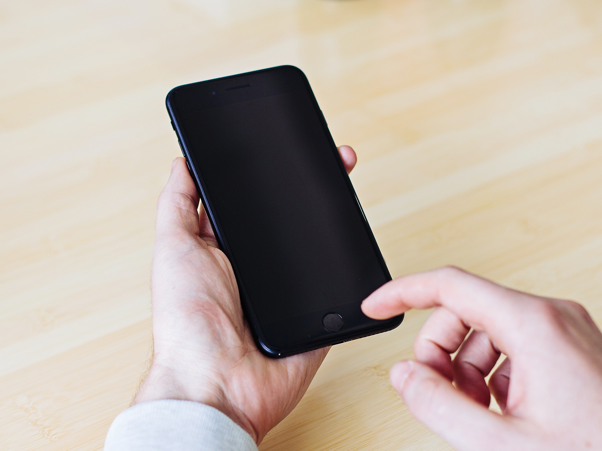 A person holding a dead phone in their hands. They should've used low power mode.