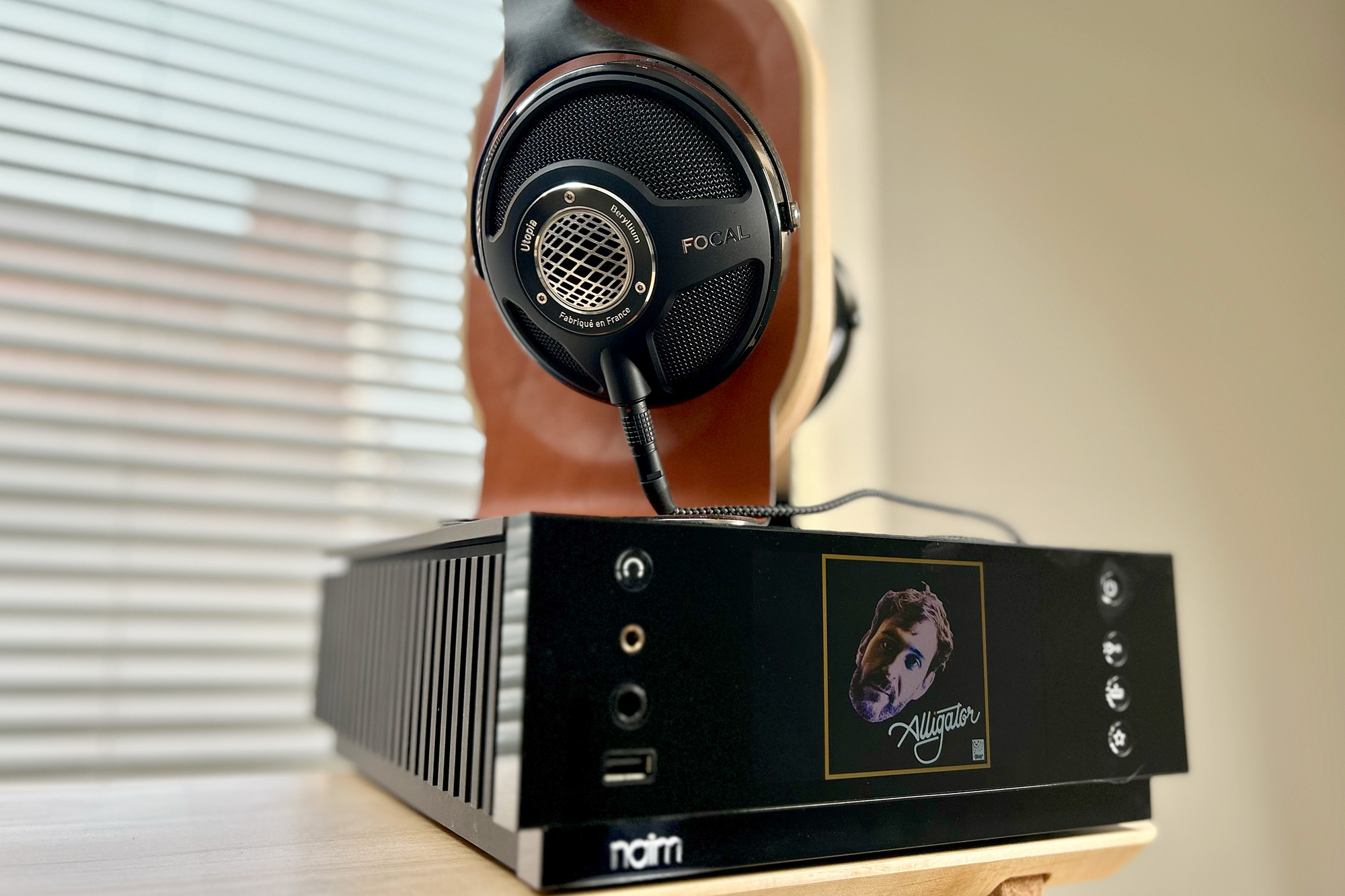 Focal Utopia on Grovemade headphone stand atop NAIM Atom