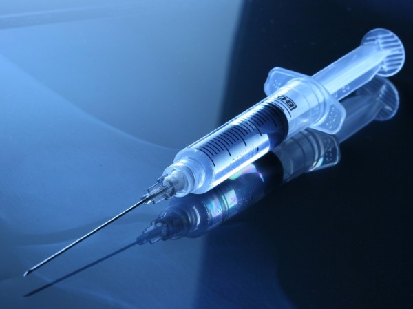 a syringe with a needle attached