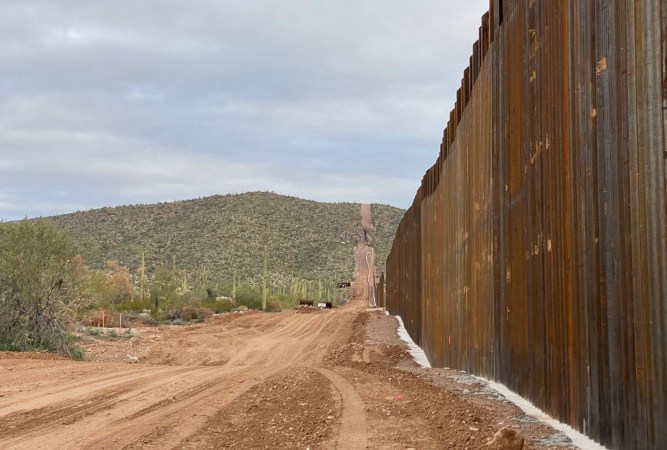 The Trump border wall made of concrete and steel on the edge of Organ Pipe Cactus National Monument in Arizona