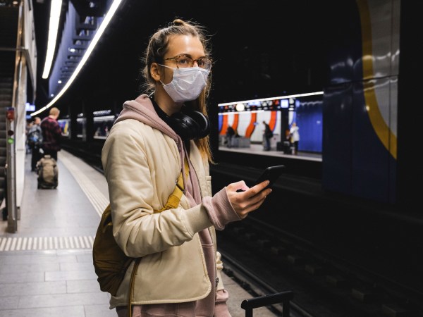 woman wearing mask in subway station