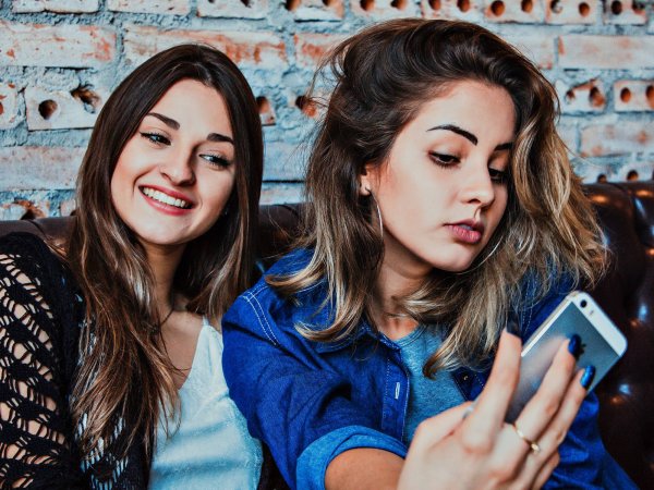 Two friends taking a selfie.