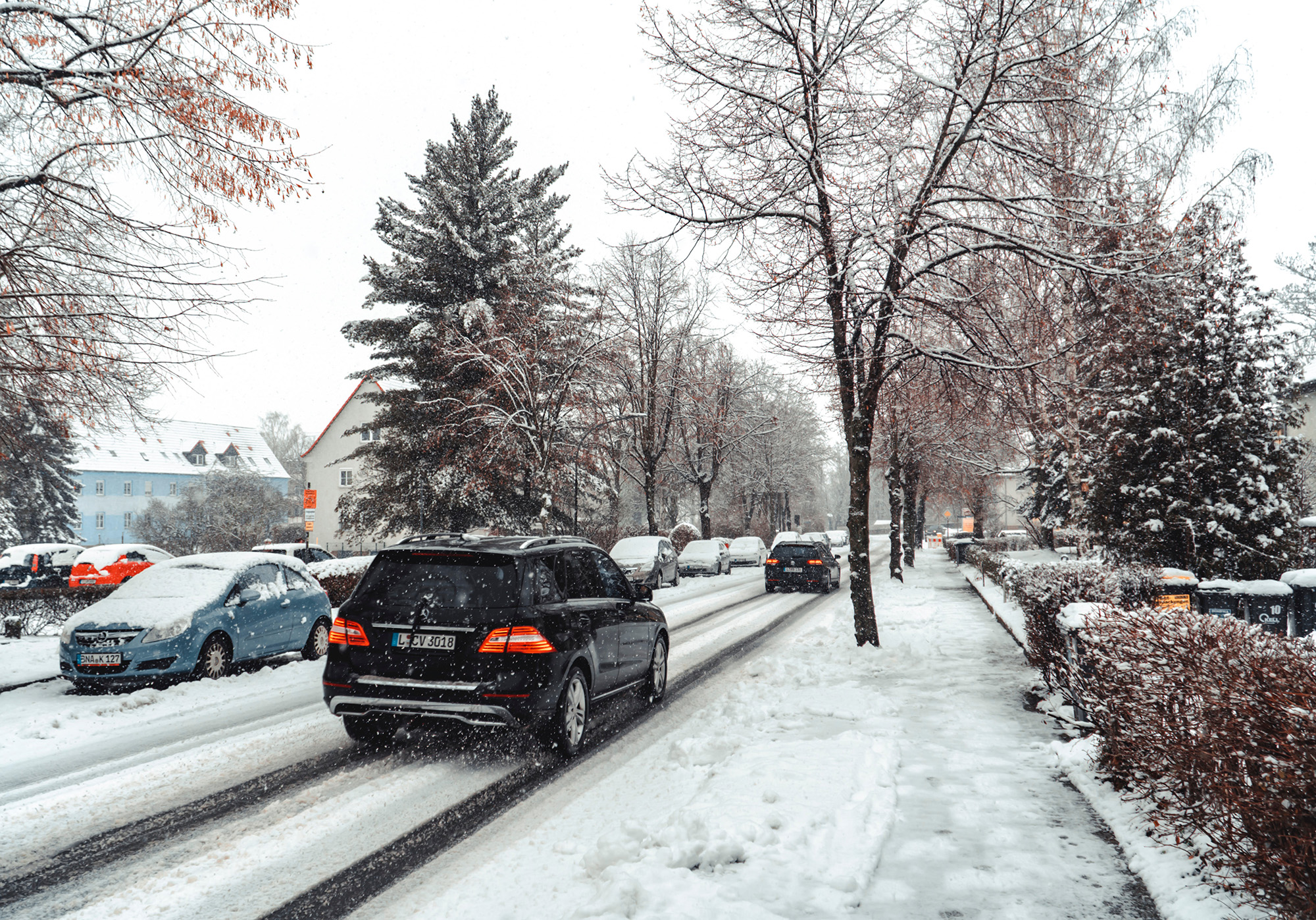 best windshield snow cover on a snowy street with cars