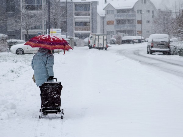 person walking in snowy street