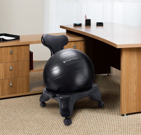 balance ball chair in an office next to a wood desk