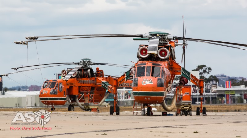 A helicopter named Elvis parked on the tarmac.