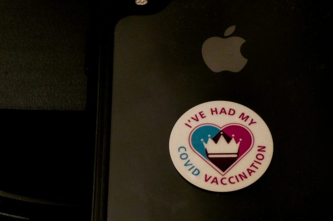 Sticker on laptop that says "I've had my COVID vaccination"
