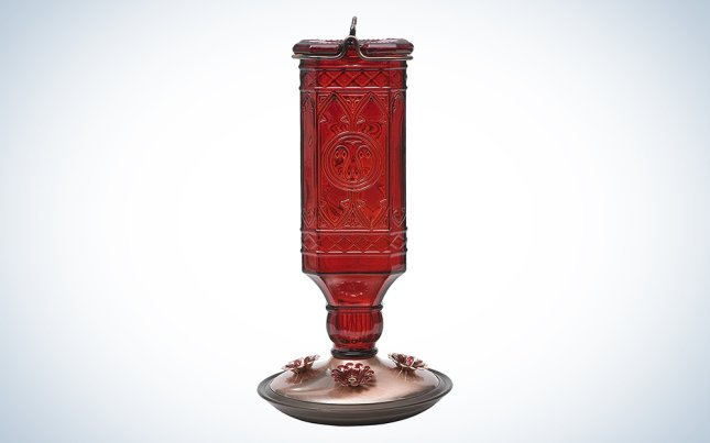 red antique glass bird feeder