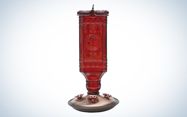 red antique glass bird feeder