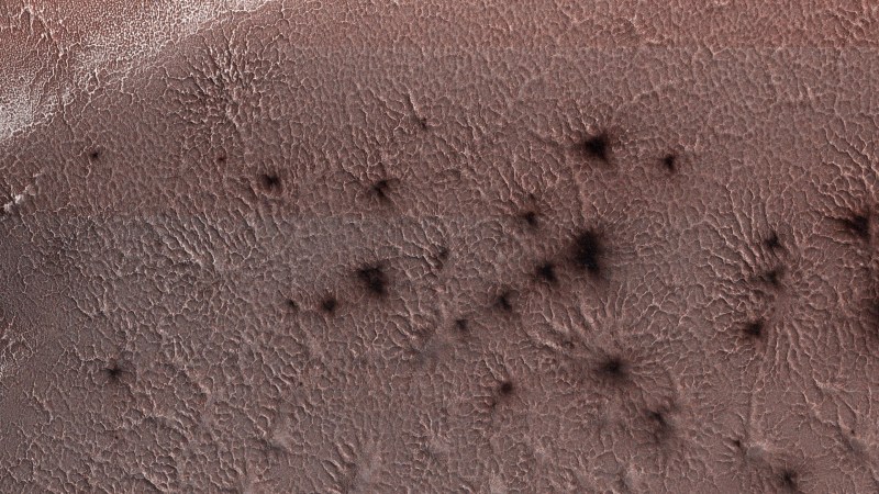 "Mars spiders," formations caused by underground carbon dioxide fizzing to the surface in springtine.