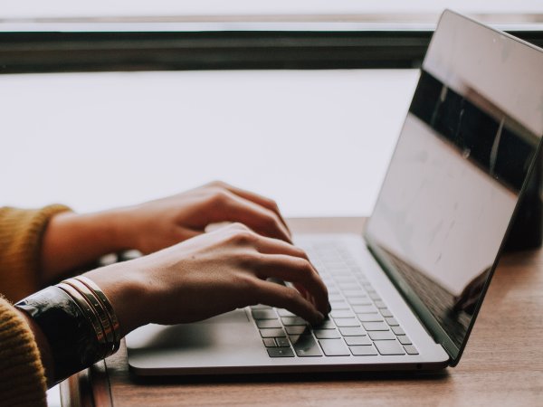 A person working on a laptop.